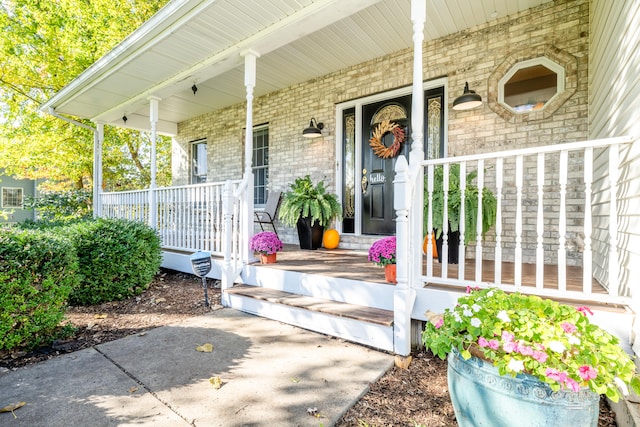 doorway to property with a porch