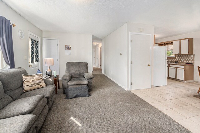 tiled living room with a textured ceiling