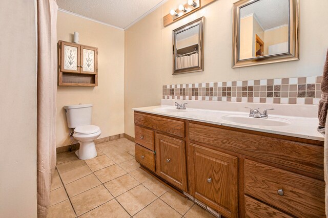 bathroom featuring tile patterned floors, decorative backsplash, toilet, vanity, and a textured ceiling