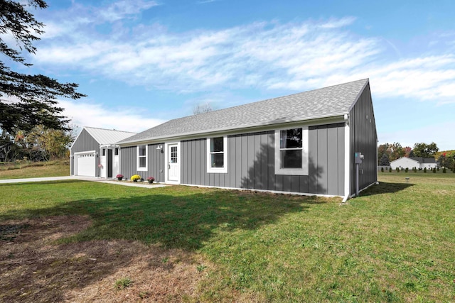 ranch-style home featuring a garage and a front lawn