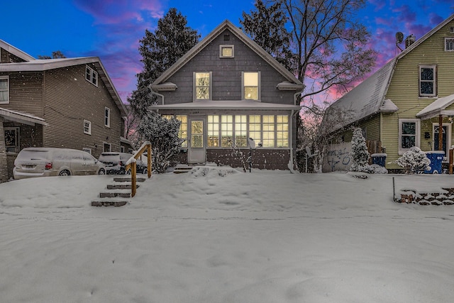 view of snow covered house