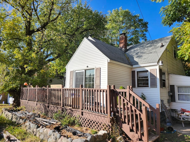 back of house featuring a deck