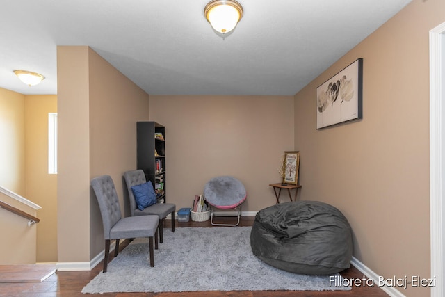 living area with hardwood / wood-style flooring