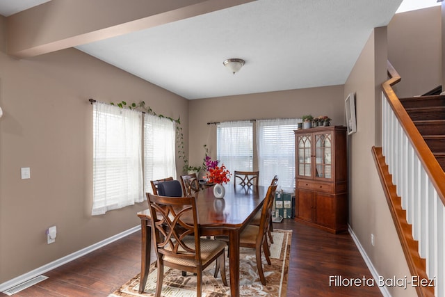 dining room with dark hardwood / wood-style floors