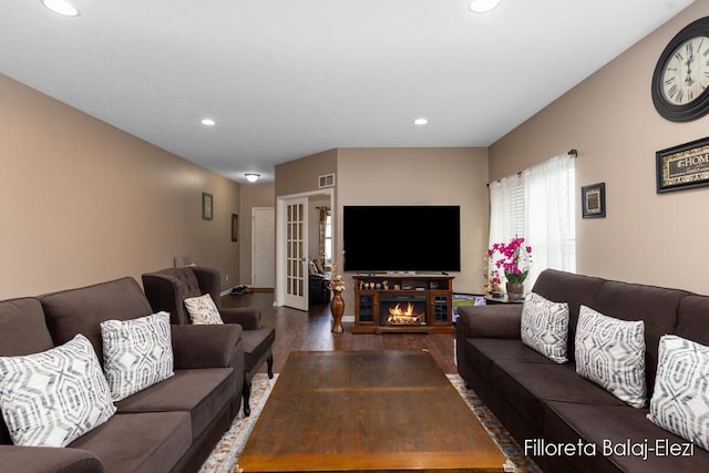 living room with french doors and dark hardwood / wood-style flooring