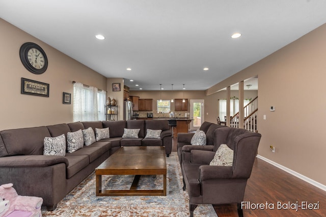 living room with hardwood / wood-style floors and a wealth of natural light