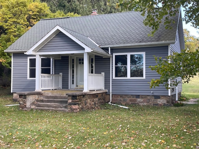 view of front of house featuring a front yard and a porch