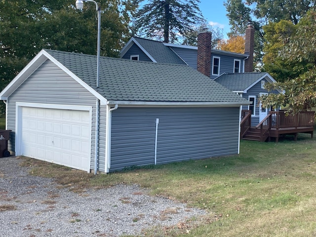 garage featuring a yard