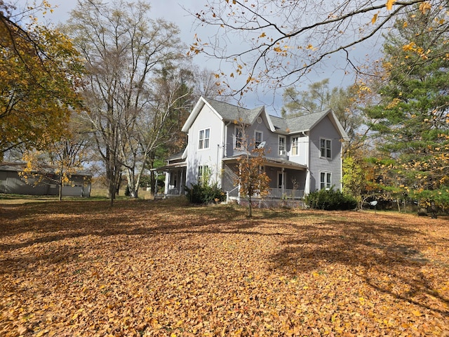 view of side of home with a porch