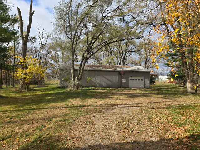 view of yard featuring a garage