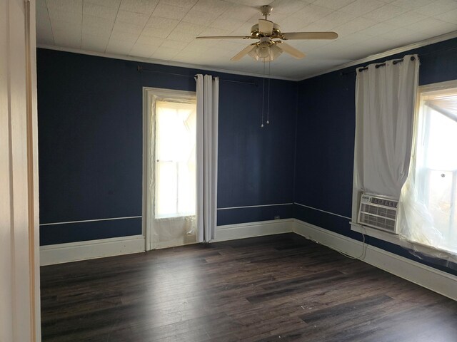 unfurnished room with dark wood-type flooring, cooling unit, crown molding, and ceiling fan