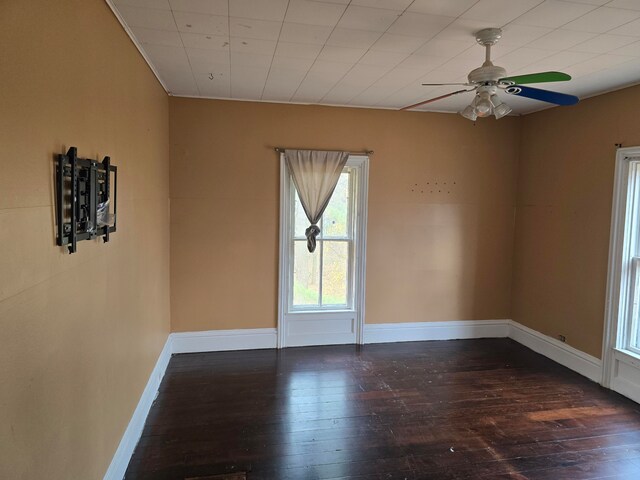 empty room with wood-type flooring and ceiling fan