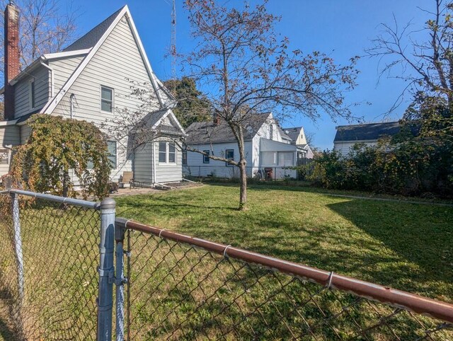 view of side of property featuring a yard