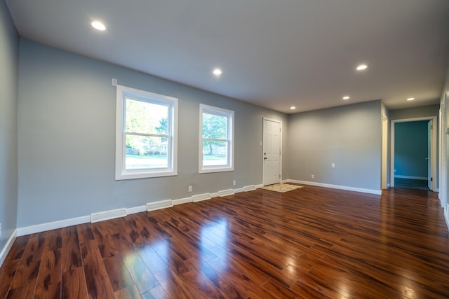 spare room featuring dark hardwood / wood-style floors