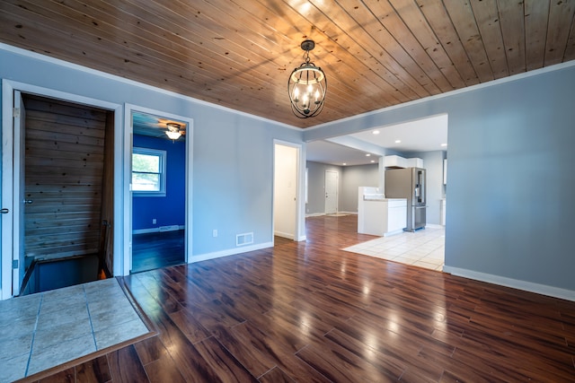 unfurnished living room with an inviting chandelier, light wood-type flooring, and wooden ceiling