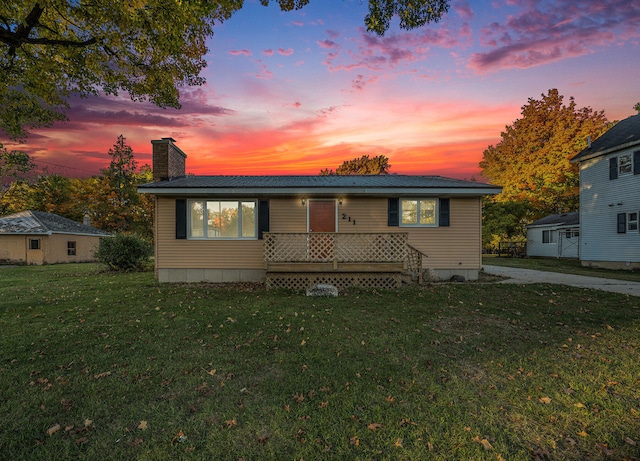 view of front of home with a lawn