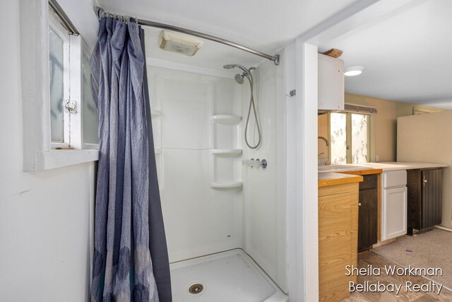 bathroom with vanity and a shower with curtain