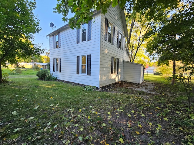 view of home's exterior featuring a yard