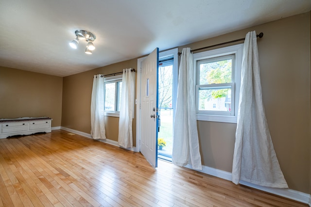 doorway with light hardwood / wood-style floors