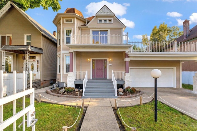 view of front of home with a balcony and a garage