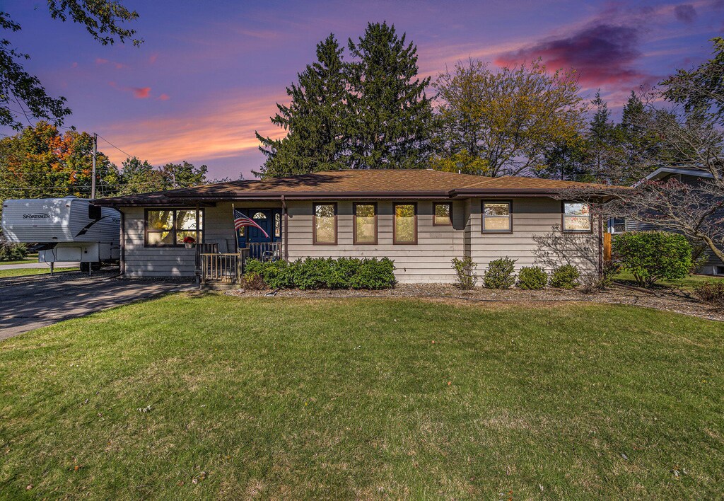 ranch-style house with a lawn