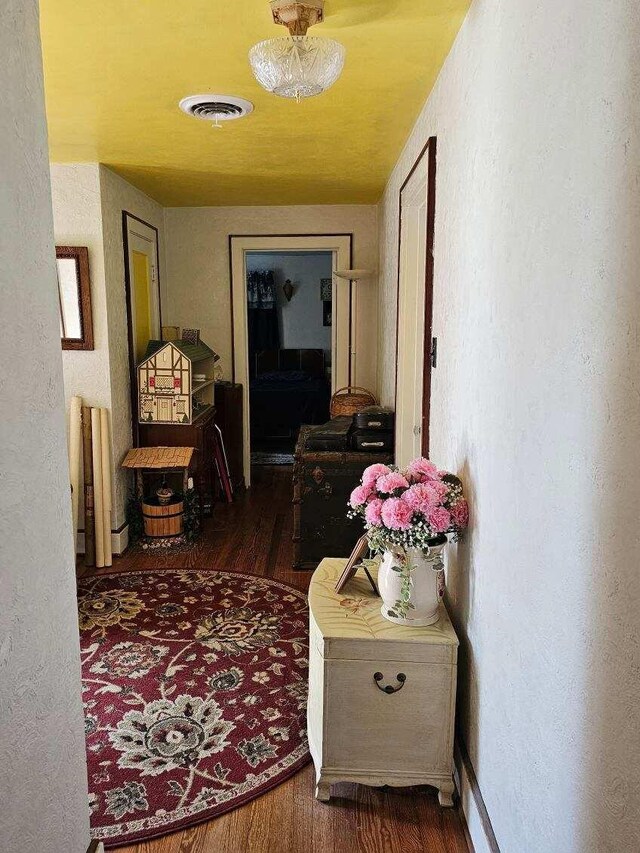 corridor featuring dark wood-type flooring