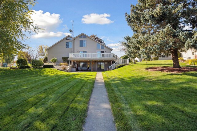 back of house with a deck and a lawn