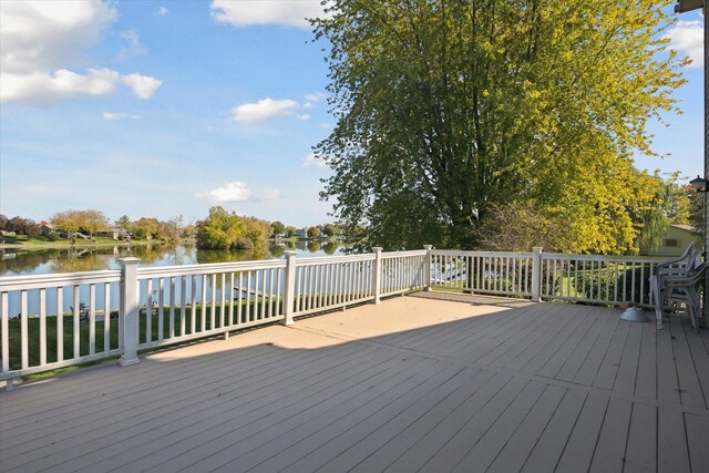 wooden deck featuring a water view