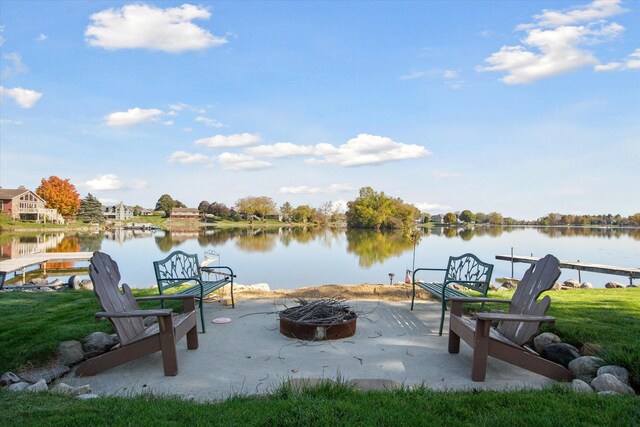 view of patio featuring a water view and an outdoor fire pit