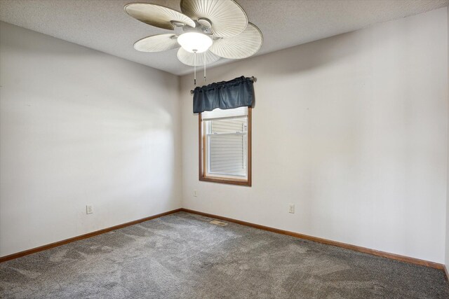 empty room featuring a textured ceiling, carpet flooring, and ceiling fan