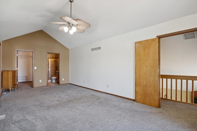 unfurnished room featuring light carpet, ceiling fan, and vaulted ceiling