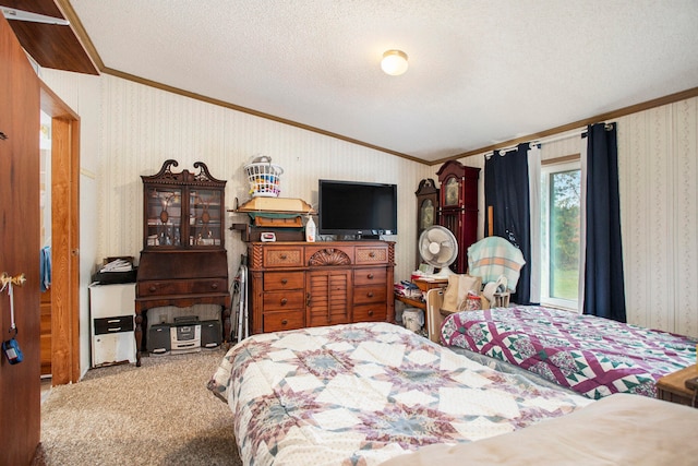 bedroom with ornamental molding, a textured ceiling, and carpet floors