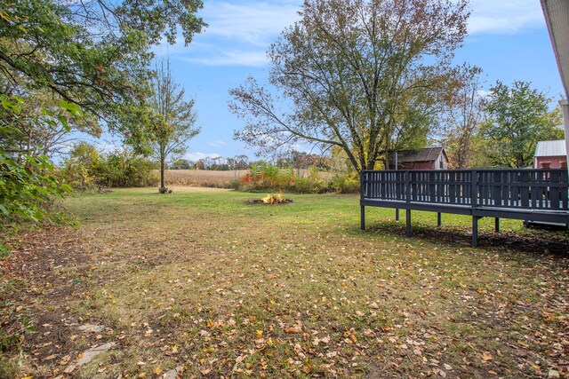 view of yard with a wooden deck