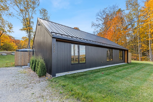 view of home's exterior with a lawn