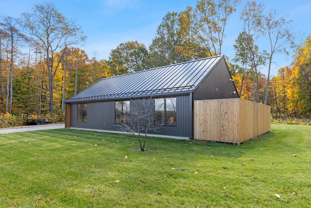 view of outdoor structure with a lawn