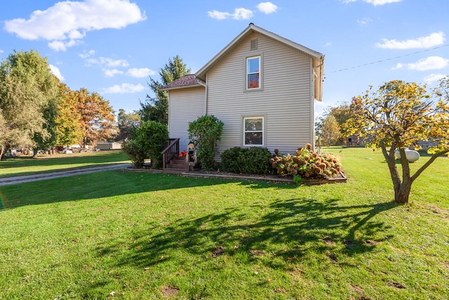 view of property exterior with a yard