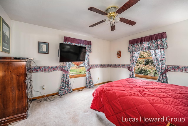 carpeted bedroom with ceiling fan