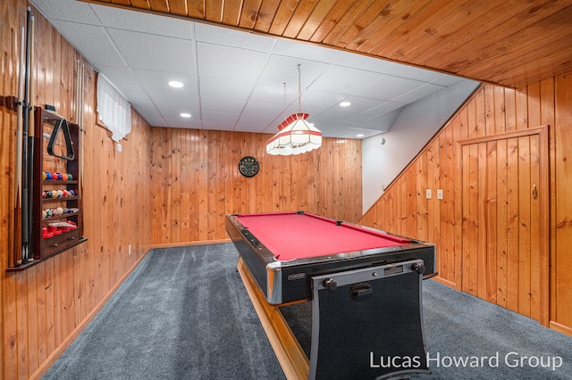 rec room with pool table, wood walls, and dark colored carpet