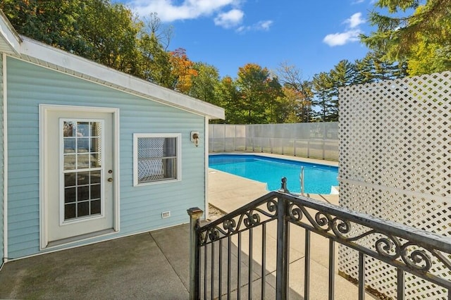 view of swimming pool with a patio area