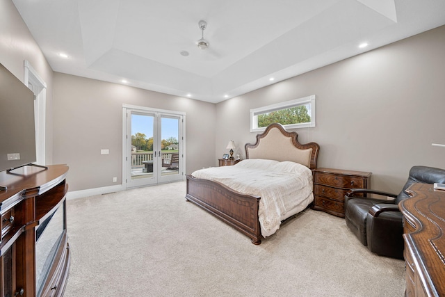 bedroom with ceiling fan, multiple windows, access to outside, and light colored carpet