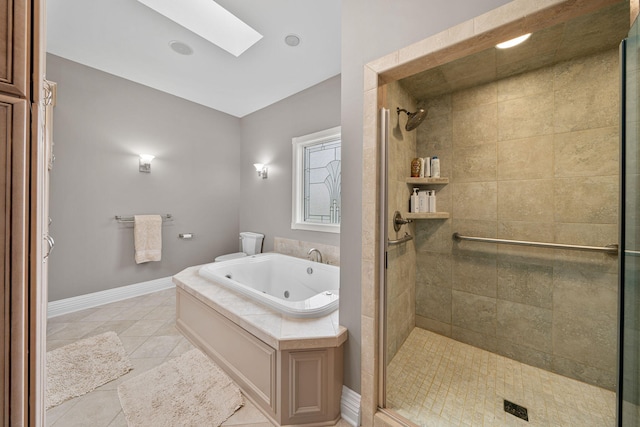 bathroom with separate shower and tub, a skylight, and tile patterned flooring