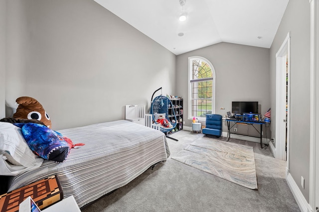 carpeted bedroom featuring lofted ceiling