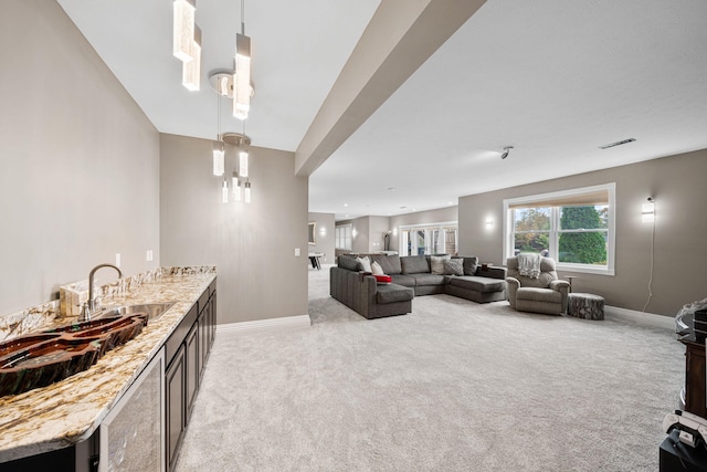 living room with lofted ceiling and light carpet