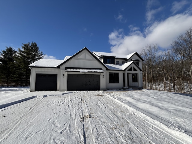 modern farmhouse style home featuring a garage