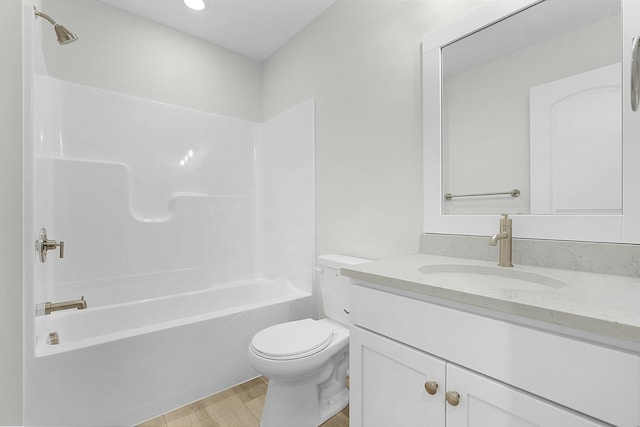 full bathroom with vanity,  shower combination, toilet, and wood-type flooring