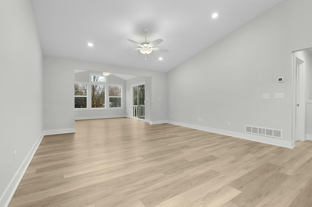 unfurnished living room with ceiling fan, vaulted ceiling, and light wood-type flooring