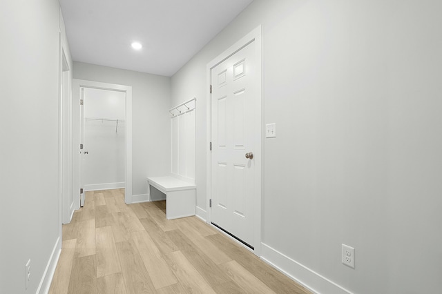 mudroom with light hardwood / wood-style floors