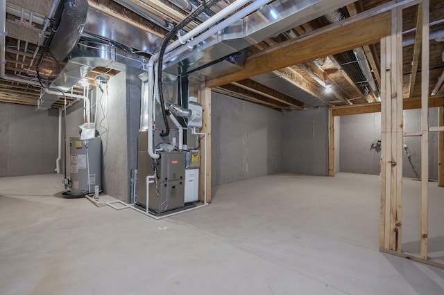 basement featuring gas water heater and heating unit