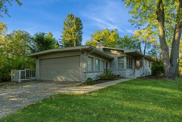 view of front of home with a garage, a chimney, concrete driveway, stone siding, and a front yard