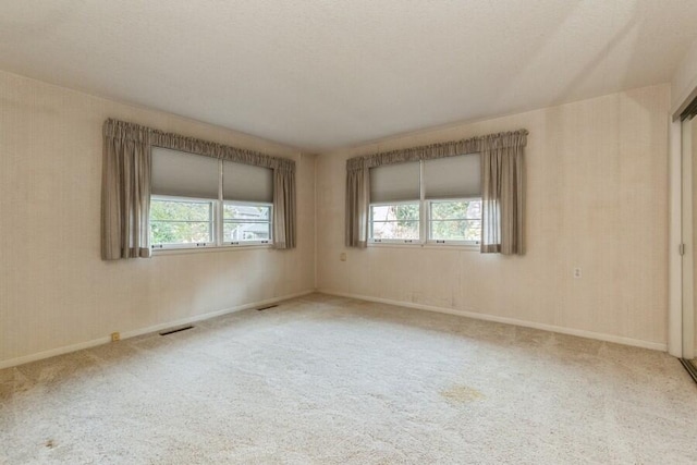 unfurnished room featuring carpet floors